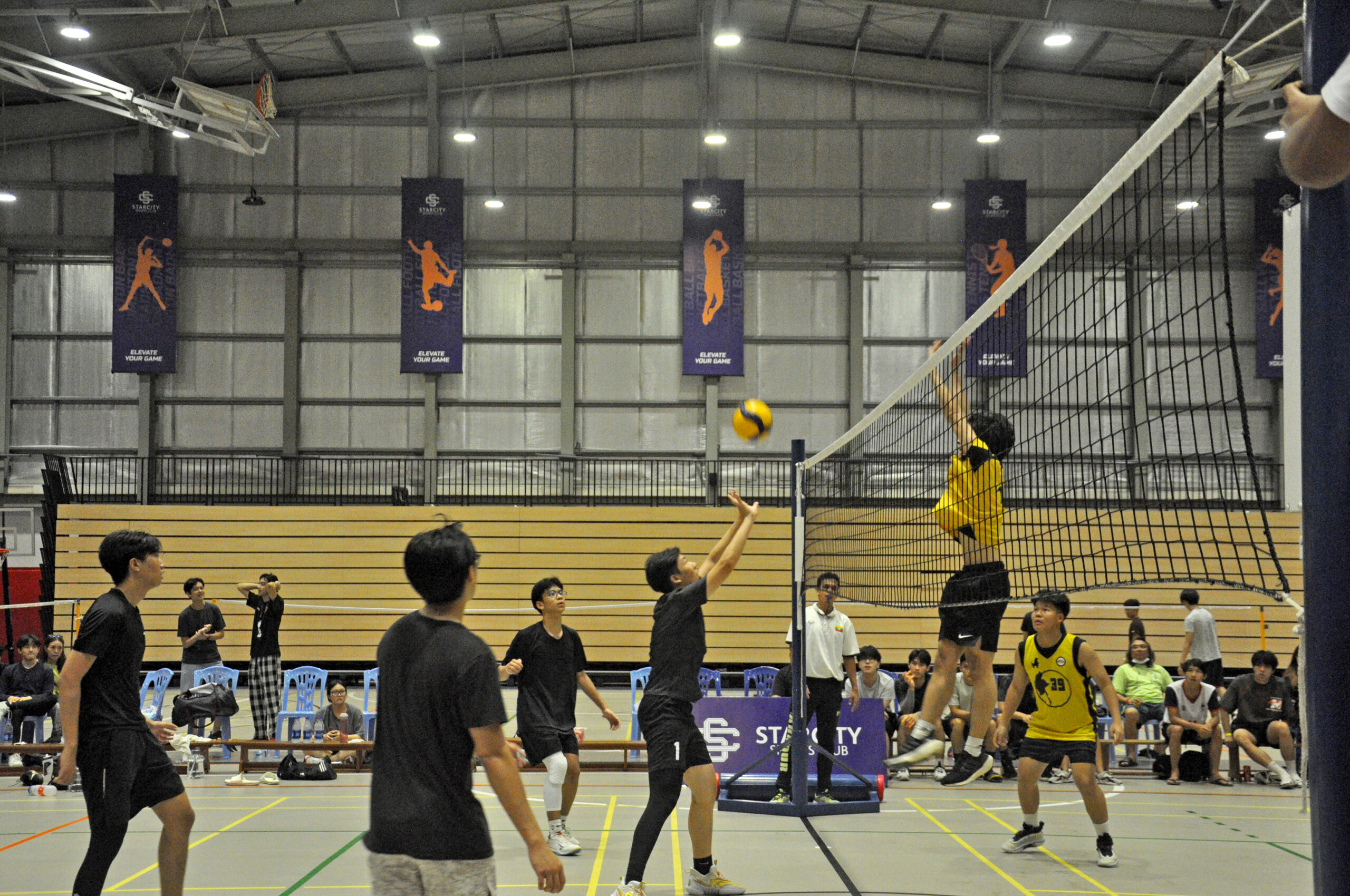 a group of young people playing volleyball