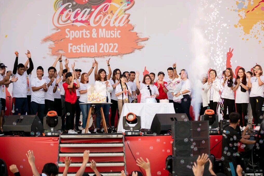 a group of people standing on a stage