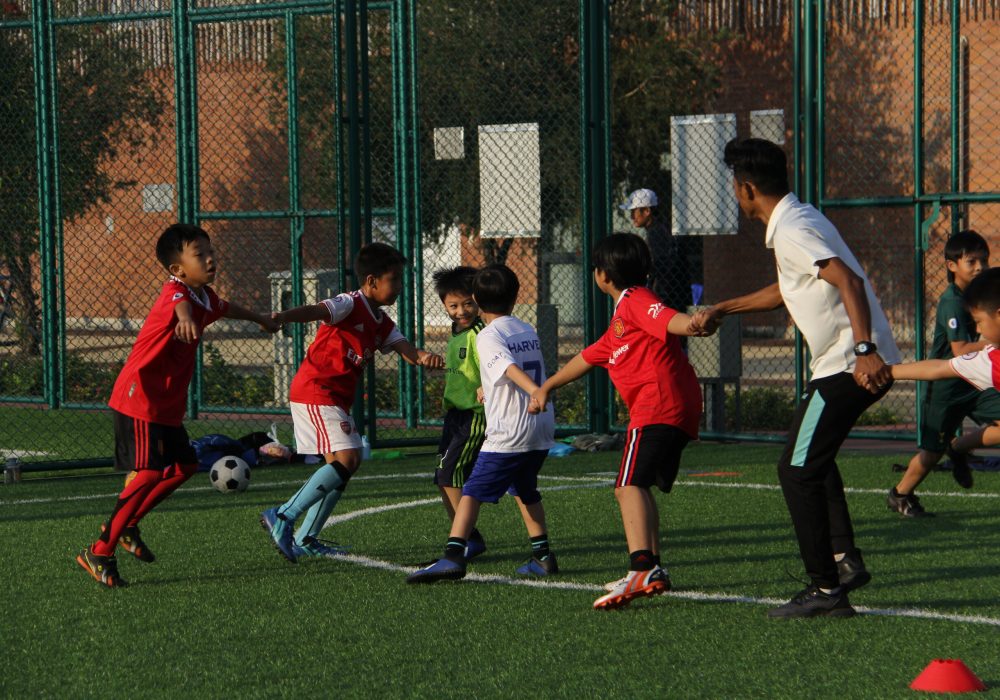 a group of kids in football training