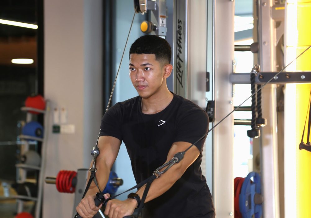 a man doing workout at a gym